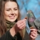 Cheerful Girl Feeding Pigeons From Hand - VideoHive Item for Sale