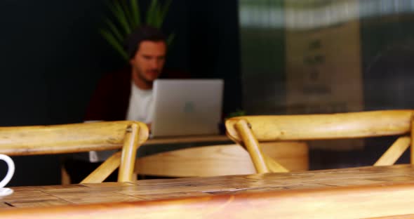 Open sign board with cup of coffee on table