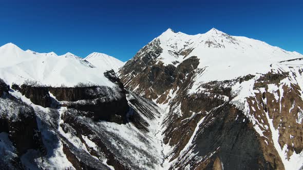 Aerial view of beautiful snowy mountains in Gudauri, Georgia