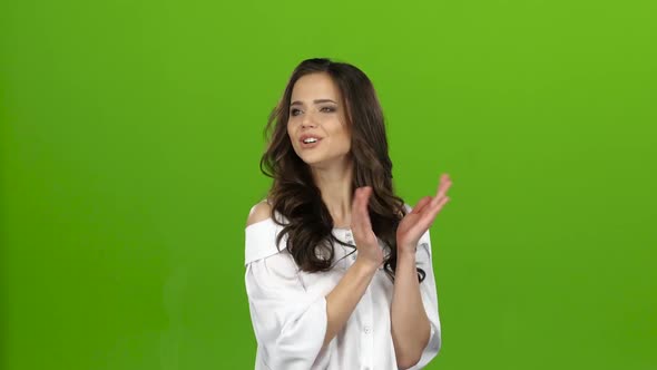 Girl Stands and Applauds a Good Performance, She Is Happy. Green Screen