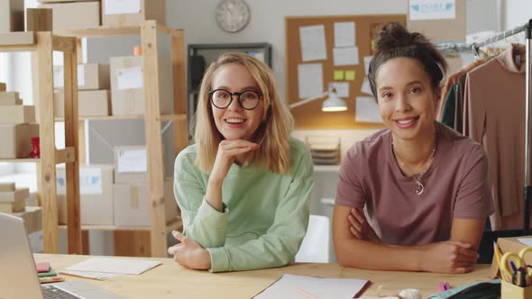 Portrait of Two Multiethnic Female Colleagues in Clothes Store