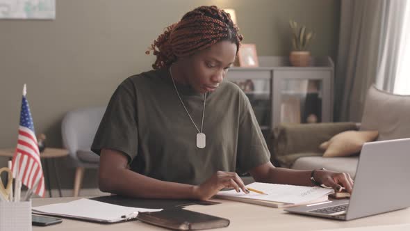 Military Woman Working from Home alt
