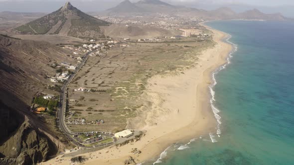 Aerial tilting up showing the Island of Porto Santo, Madeira, Portugal.