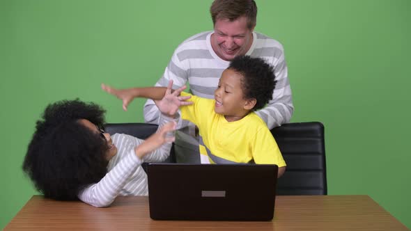 Young Scandinavian Man and Two Young African Siblings Together