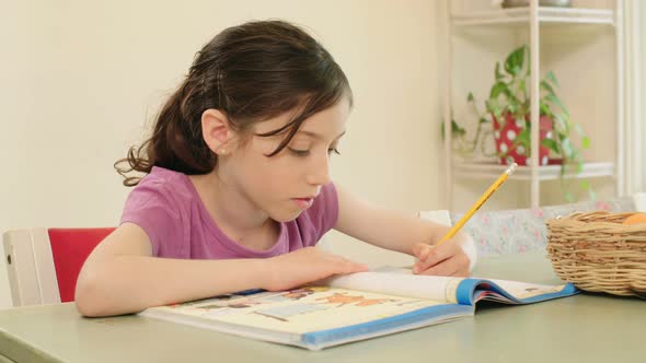 Girl preparing homework at home