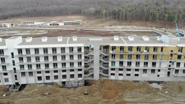 Flying Over a House Under Construction, The House Surrounding the Sports Complex Is Under