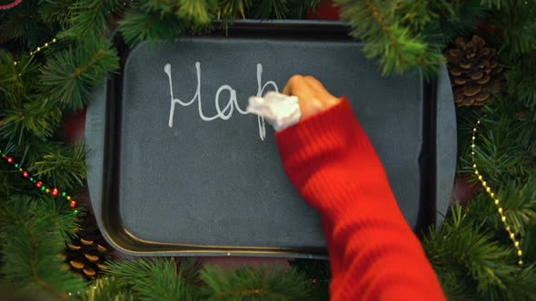 Happy New Year, Female Hand Writing Word With Cream on Baking Tray, December