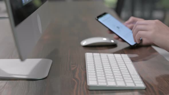 Close Up Shoot of Young Woman Hands Using Smartphone and Keyboard