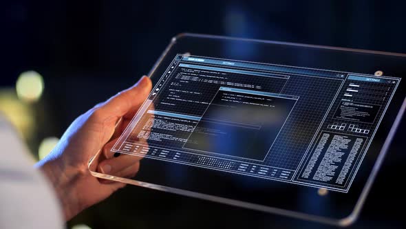 Hand Holding Tablet Pc with Coding on Screen 14