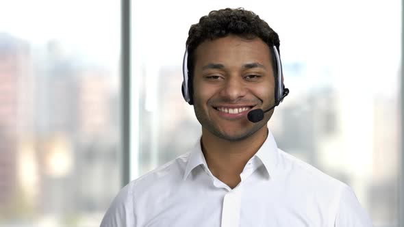 Male Call Center Operator Looking at Camera.