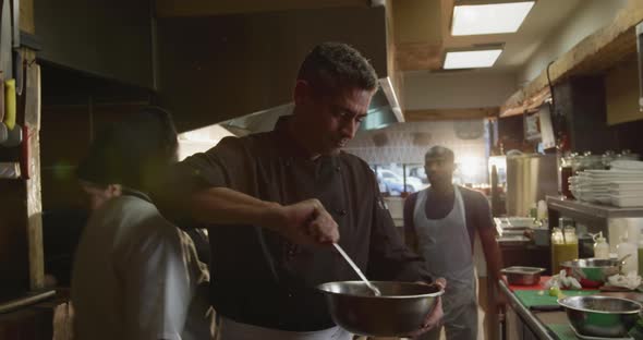 Caucasian man cooking in the kitchen