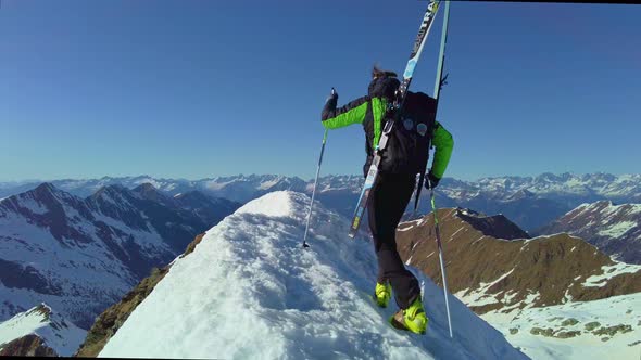 Mountaineer Skier At The Top Of The Mountain