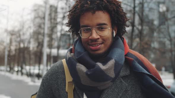 Portrait of Young Afro-American Man Outdoors on Winter Day