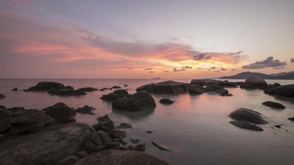 Timelapse of amazing red cloud sunset  at rocky stone