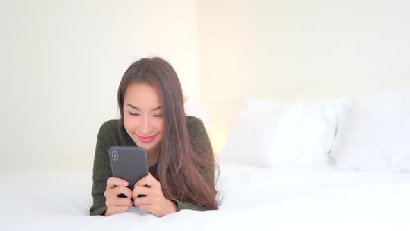 Young asian woman use smart phone