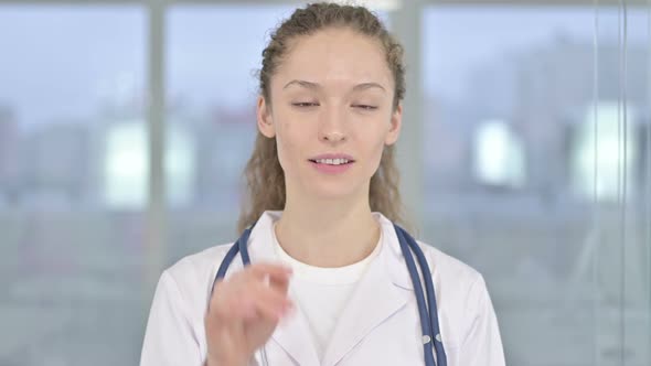 Portrait of Beautiful Young Female Doctor Doing Video Chat