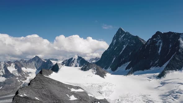 Aeriale Establishing Shot of the Swiss Alps in the Bern region with the Finsteraarhorn peak in the m