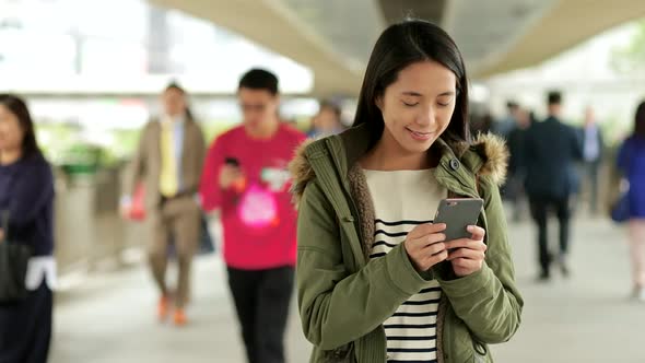 Slow motion of woman use of cellphone