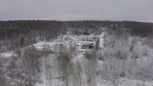 a Destroyed Building As After the War in the Middle of a Forest Landscape in Winter