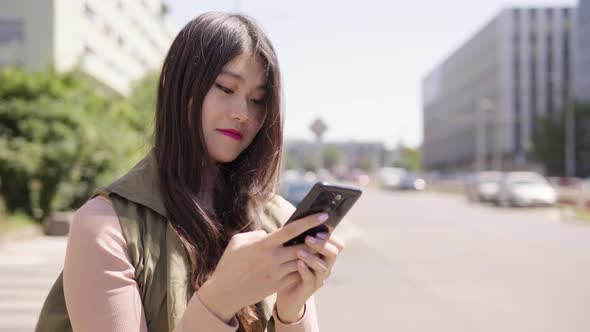 Young Asian Woman Works Smartphone Smile Street Urban Area