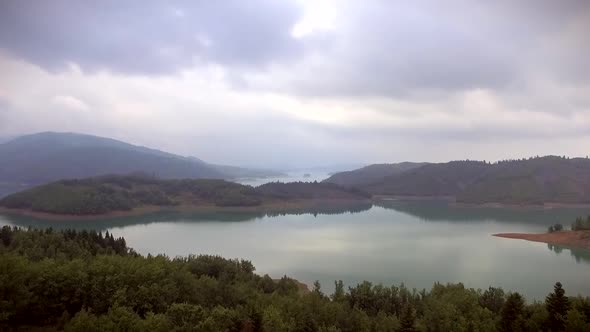 Aerial view of the beautiful Plastiras Lake on a cloudy day in Greece.