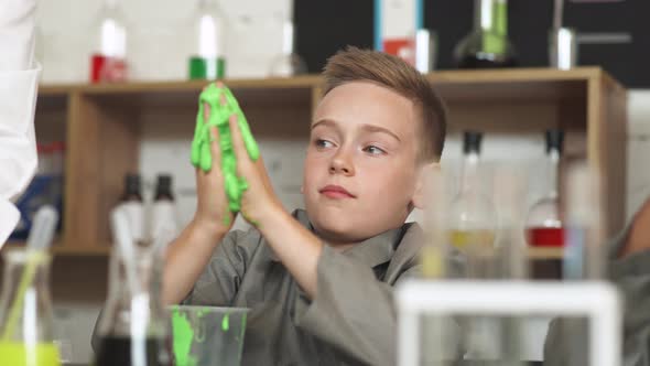 Laboratory Experience in a Chemistry Lesson, the Boy Playing with a Light Green Slime, Children's