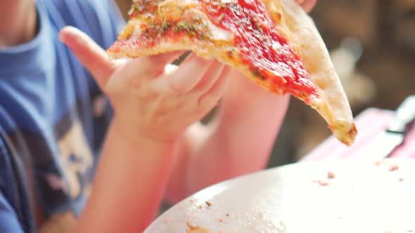 kid boy eating italian pizzaItaly