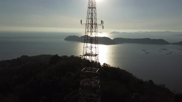 Aerial ascending silhouette telecommunication tower