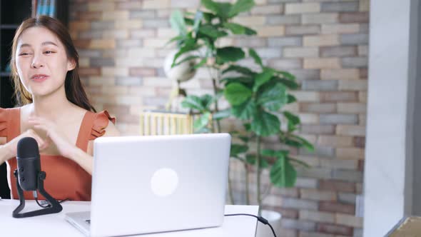 Woman with Mic Recording a Podcast