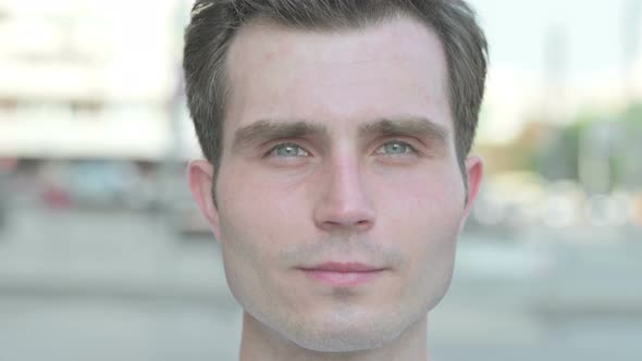 Face Close Up of Serious Young Man Outdoor