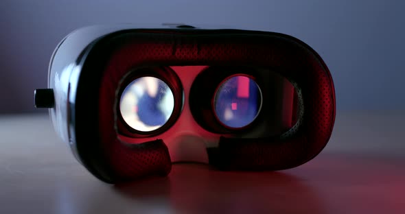 Virtual reality device playing video inside with red light at the back