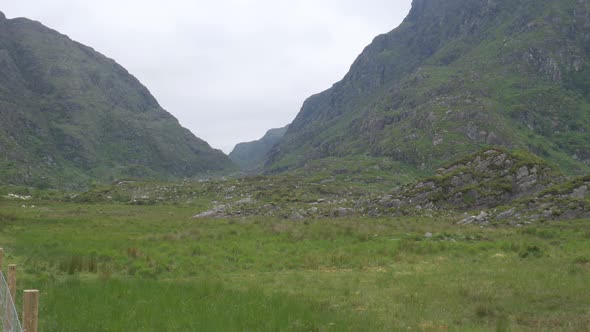 MacGillycuddy's Reeks And Purple Mountain Group At The Head Of The Gap Of Dunloe In Ireland. wide sh