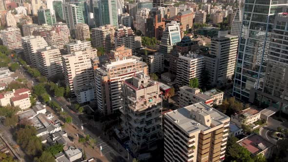 Aerial shot of luxury buildings and street with traffic on a sunny afternoon, Santiago de Chile-4K