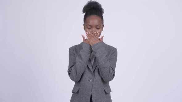 Young African Businesswoman Covering Mouth As Three Wise Monkeys Concept