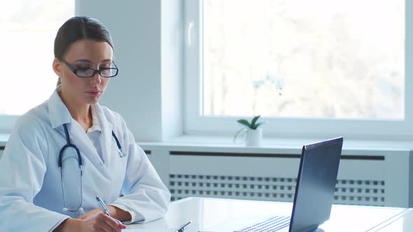 Professional medical doctors working in hospital office making research.