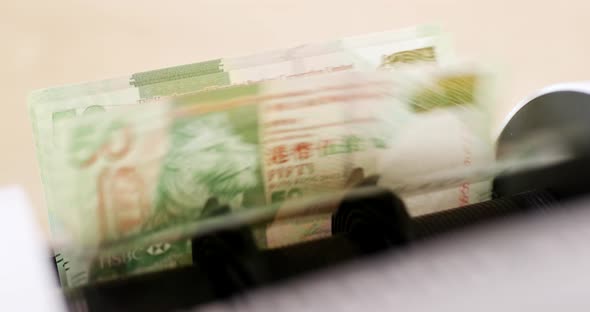 Hong Kong dollar on counting machine
