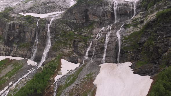 Aerial View Drone Footage Several Waterfalls Flowing Down Steep Large Rocks High in the Mountains