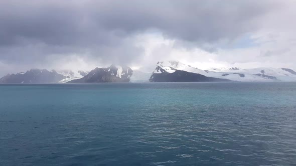 Glacier of Antarctica Far on the Horizon Cloudy Day