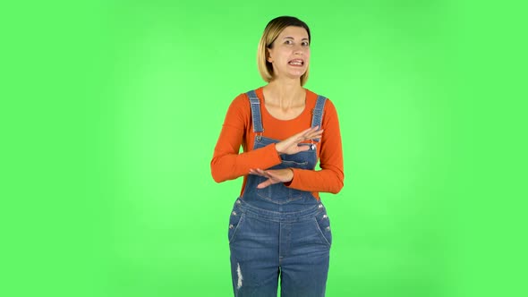 Unhappy Girl Showing Thumbs Down Gesture. Green Screen