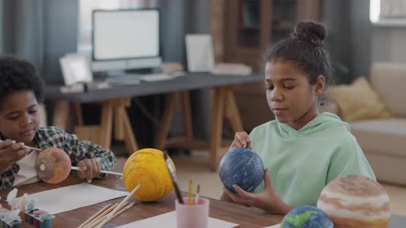 Afro Kids Crafting And Painting Globe Models