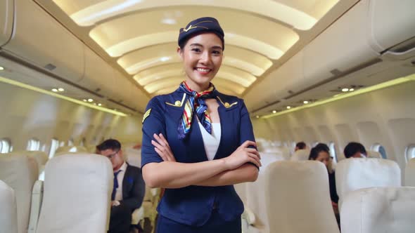 Cabin Crew or Air Hostess Working in Airplane