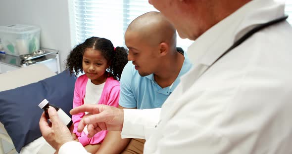 Male doctor prescribing medicine to patient