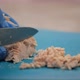 Woman Slices a Boiled Chicken Fillet on a Blue Cut Board - VideoHive Item for Sale