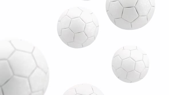 White soccer ball falling in slow motion, looped switch