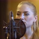 Young Attractive Female Singer Sings A Song On Microphone - VideoHive Item for Sale