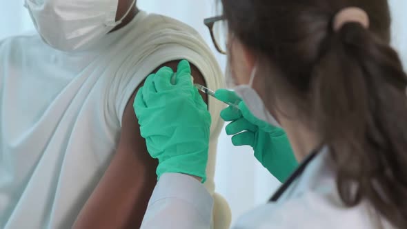 Young Man Visits Skillful Doctor at Hospital for Vaccination