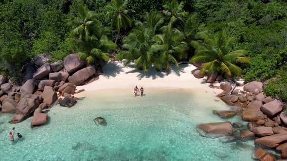 Praslin Seychelles Tropical Island with Withe Beaches and Palm Trees Couple Men and Women Mid Age on