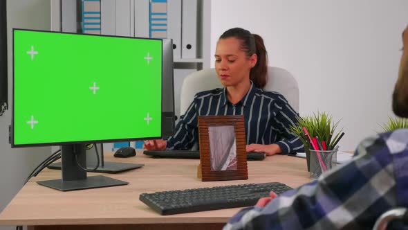 Disabled Freelancer Looking at Green Screen Display