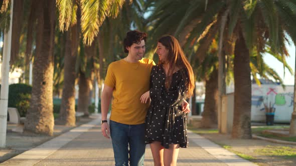 Happy couple walking on beach