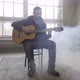 Young Man Playing Guitar in the Room - VideoHive Item for Sale